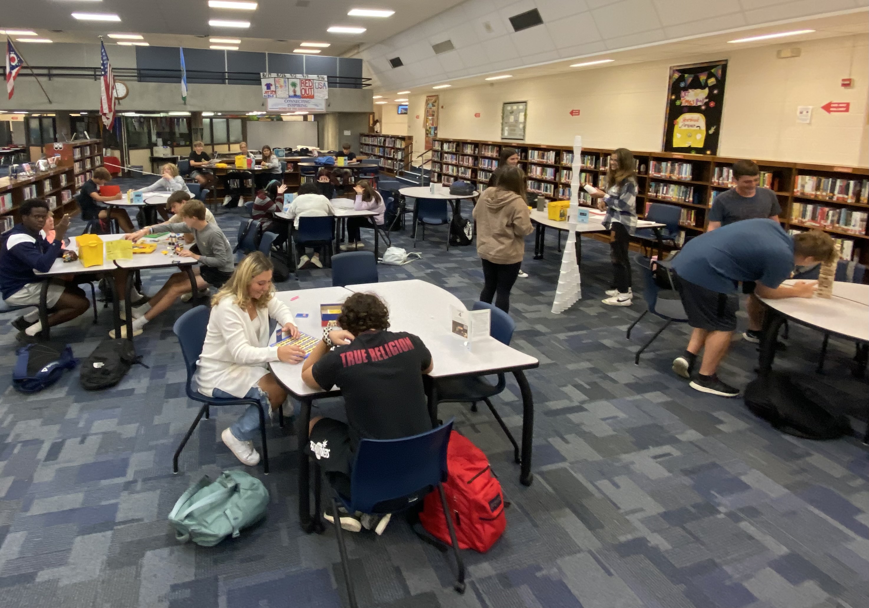 Students engage in creative activities at tables in Grove City High School's library during "No Tech Tuesday."